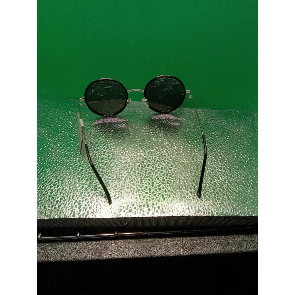 Ophelia Roe sunglasses with a black round frame and silver-tone metal temples